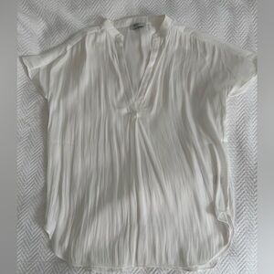 White silky short sleeved blouse.